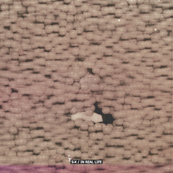 Cover artwork for In Real Life