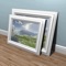 Hang-a-Pic greatly simplifies the tedious and sometimes difficult task of hanging multiple, equally aligned pictures, mirrors, decorative plates, candles or any other wall mounted ornaments