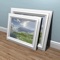 Hang-a-Pic greatly simplifies the tedious and sometimes difficult task of hanging multiple, equally aligned pictures, mirrors, decorative plates, candles or any other wall mounted ornaments