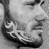 Beart, trim your beard with tribal tattoos.